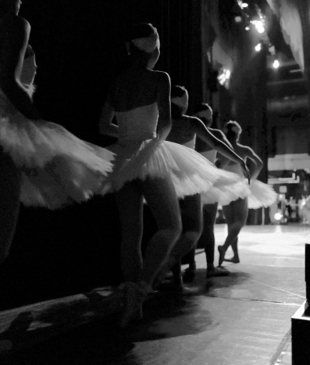 5 ballerinas preparing to dance