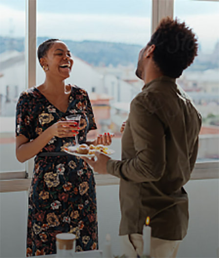 A couple laughing during conversation