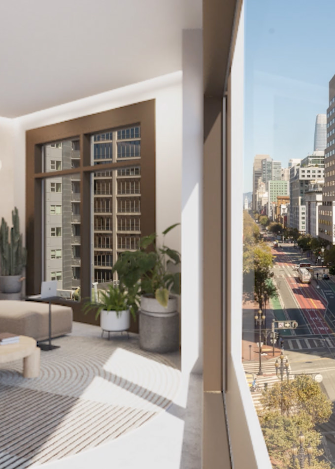 Showcasing the large windows allowing in lots of light and city views