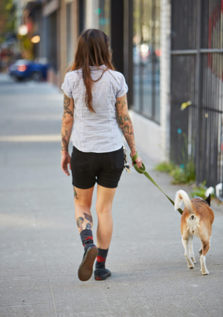 Woman walking a dog